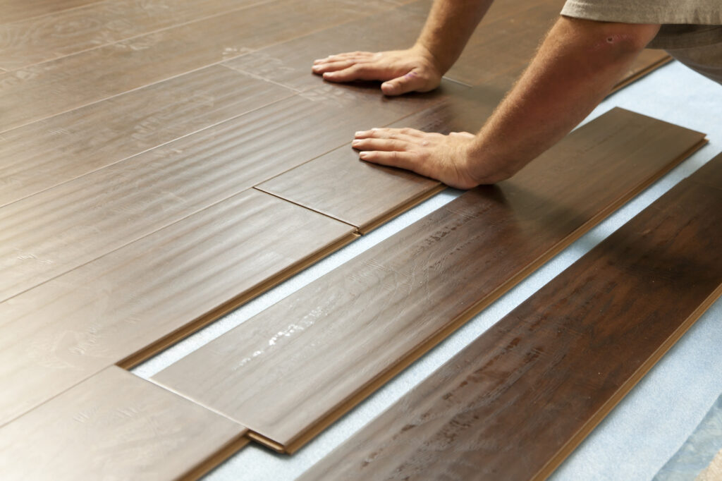 a man who installing laminate floors